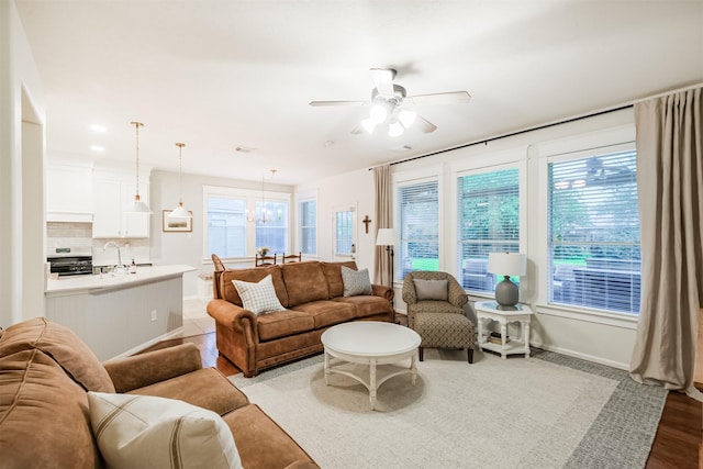 703 Rock Creek Ct, Rosenberg, TX 77469 - living area with ceiling fan, plenty of natural light, and wood finished floors