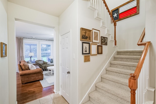 703 Rock Creek Ct, Rosenberg, TX 77469 - staircase with baseboards and tile patterned flooring