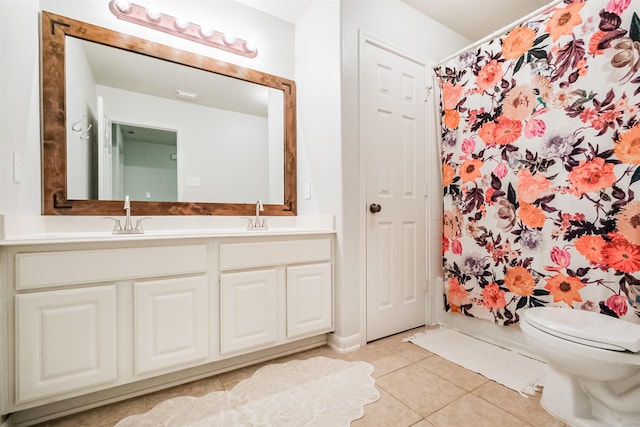 703 Rock Creek Ct, Rosenberg, TX 77469 - bathroom with tile patterned floors, double vanity, and a shower with curtain