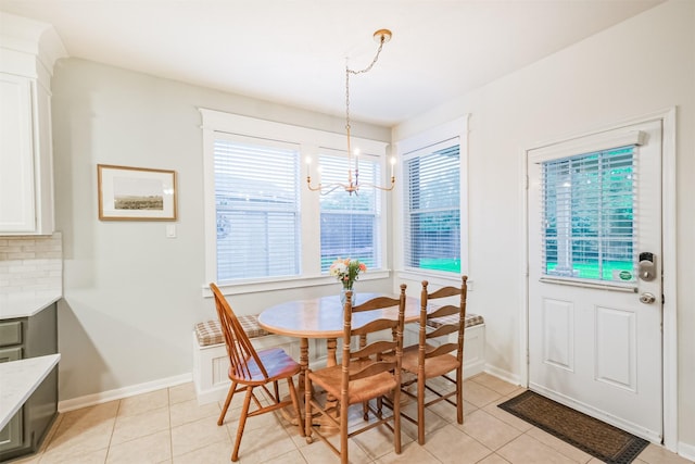 703 Rock Creek Ct, Rosenberg, TX 77469 - dining area featuring light tile patterned floors and a chandelier