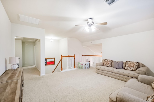 703 Rock Creek Ct, Rosenberg, TX 77469 - living room with attic access, a ceiling fan, and carpet flooring