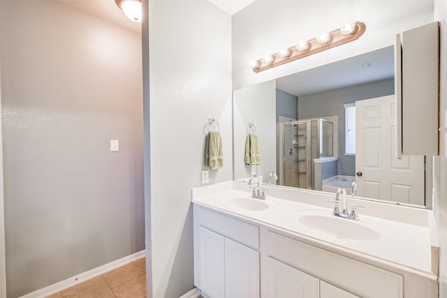 703 Rock Creek Ct, Rosenberg, TX 77469 - bathroom with a stall shower, double vanity, tile patterned flooring, and a bath