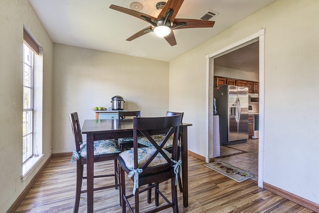 1603 Chart Dr, Crosby, TX 77532 - dining space featuring light wood finished floors, plenty of natural light, and ceiling fan