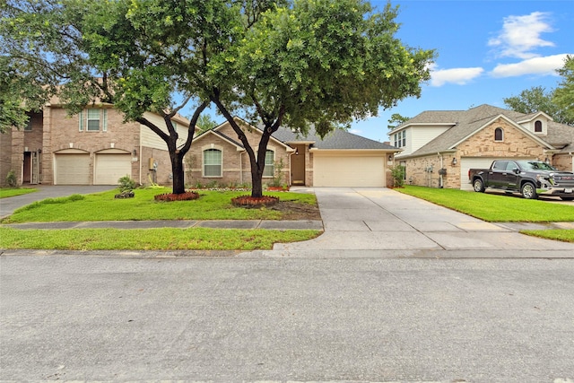 16306 Ancient Forest Dr, Humble, TX 77346 - traditional-style house with concrete driveway, brick siding, and a front lawn