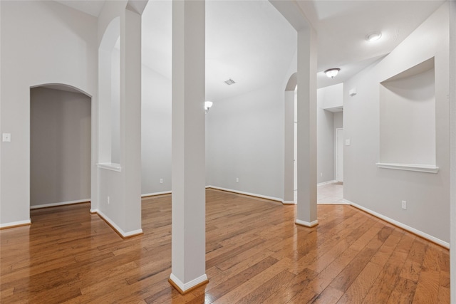 16306 Ancient Forest Dr, Humble, TX 77346 - interior space with arched walkways and wood finished floors