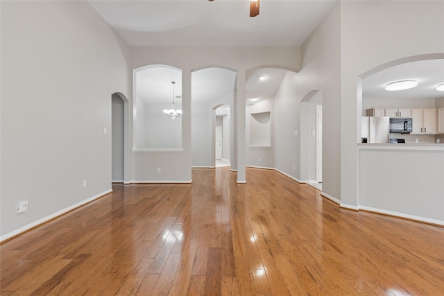 16306 Ancient Forest Dr, Humble, TX 77346 - unfurnished living room with light wood finished floors and ceiling fan