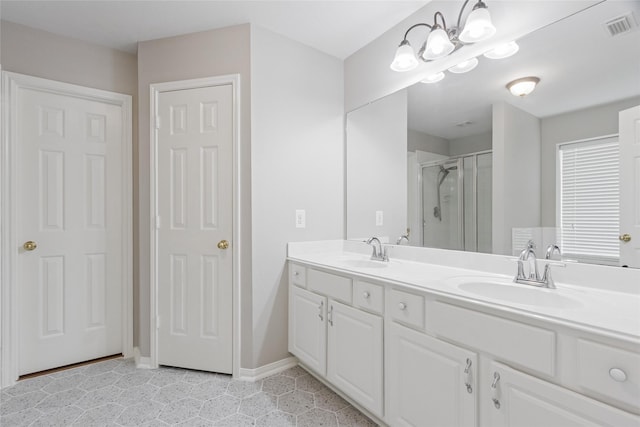 16306 Ancient Forest Dr, Humble, TX 77346 - bathroom with a shower stall, double vanity, and tile patterned floors