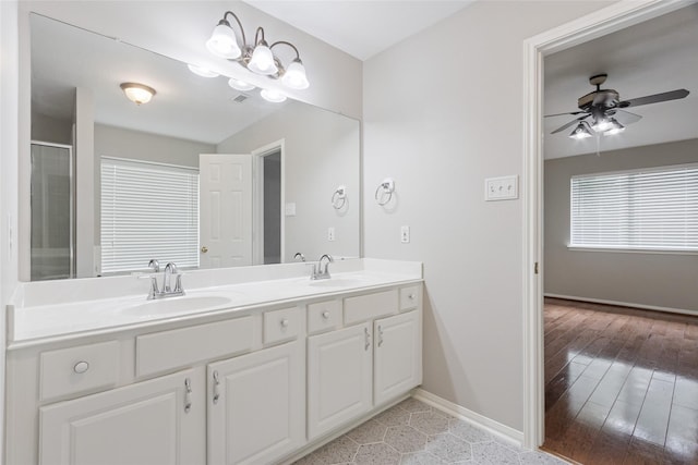 16306 Ancient Forest Dr, Humble, TX 77346 - bathroom featuring double vanity, ceiling fan, and a shower with shower door