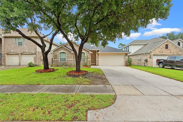 16306 Ancient Forest Dr, Humble, TX 77346 - traditional home featuring concrete driveway, an attached garage, a front lawn, and brick siding