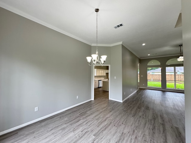 819 Companion Dr, Crosby, TX 77532 - empty room with ornamental molding, a chandelier, a ceiling fan, dark wood-type flooring, and recessed lighting