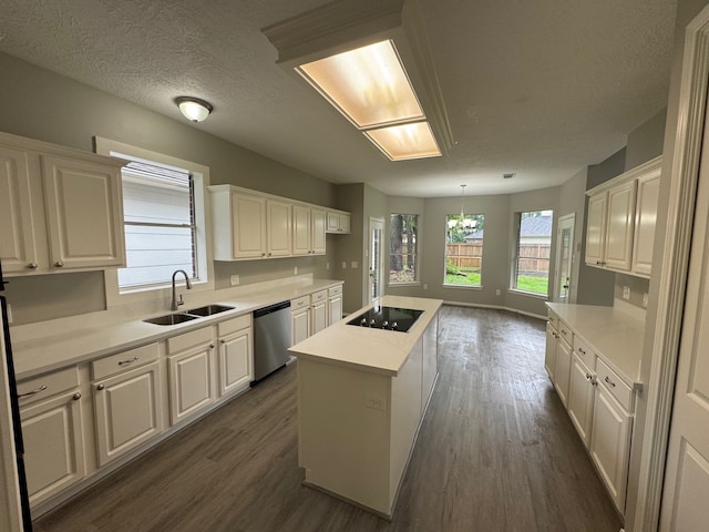 819 Companion Dr, Crosby, TX 77532 - kitchen with dishwasher, black electric cooktop, dark wood-style floors, and a kitchen island