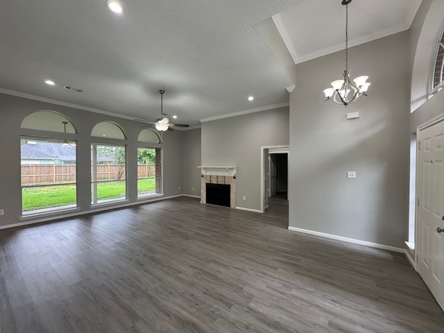 819 Companion Dr, Crosby, TX 77532 - unfurnished living room with ornamental molding, a ceiling fan, recessed lighting, a chandelier, and a tile fireplace