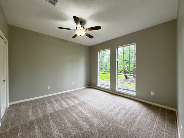 819 Companion Dr, Crosby, TX 77532 - spare room with carpet floors, a ceiling fan, and a textured ceiling