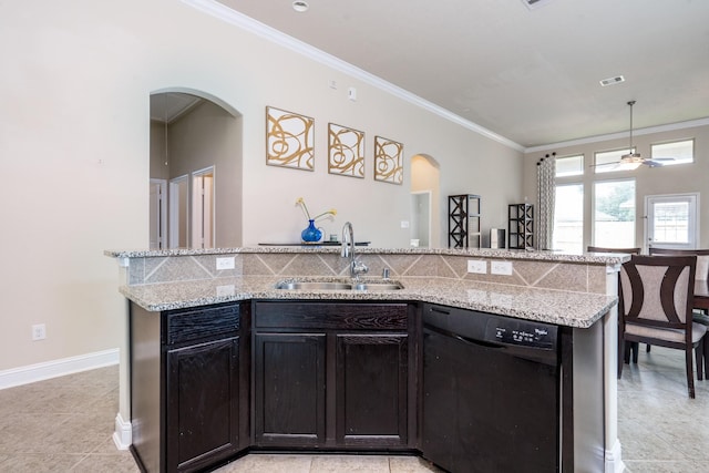 8506 Clarkman Ridge Ln, Cypress, TX 77433 - kitchen featuring dishwasher, arched walkways, crown molding, light stone countertops, and an island with sink