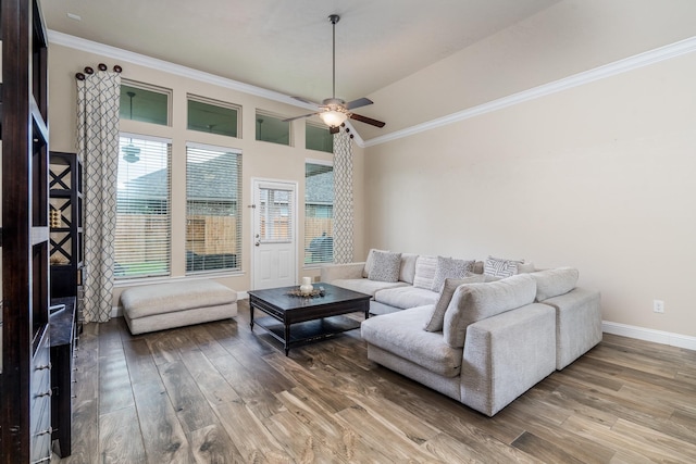 8506 Clarkman Ridge Ln, Cypress, TX 77433 - living area with wood finished floors, ceiling fan, and crown molding