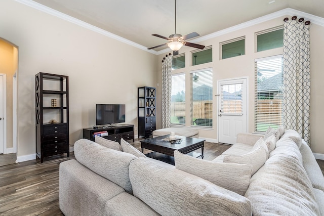 8506 Clarkman Ridge Ln, Cypress, TX 77433 - living area with dark wood-style floors, a ceiling fan, ornamental molding, and arched walkways