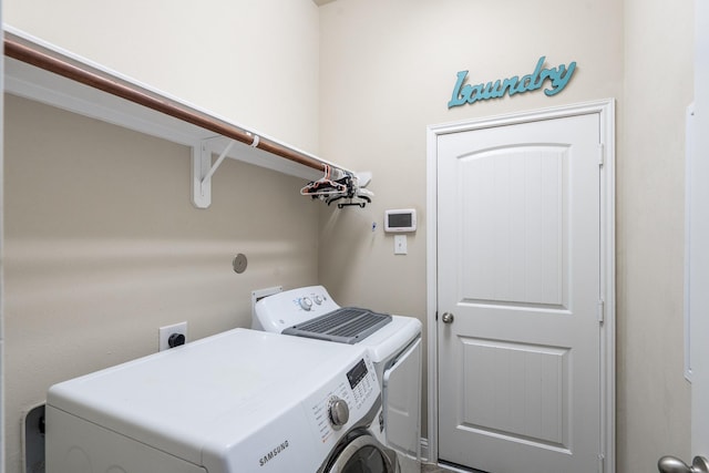 8506 Clarkman Ridge Ln, Cypress, TX 77433 - laundry room featuring washing machine and dryer