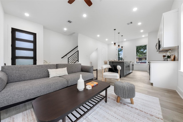 2475 Carmel St A/B, Unit A/B Houston, TX 77091 - living room with light wood finished floors, stairs, a ceiling fan, and recessed lighting