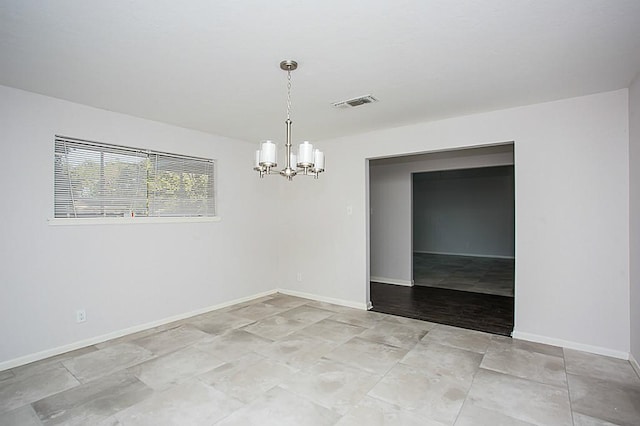 6407 Nuben St, Houston, TX 77091 - unfurnished room with a chandelier and light stone finish floors