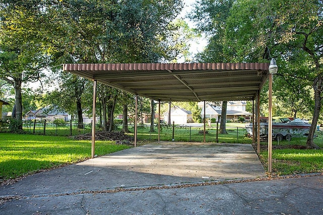 6407 Nuben St, Houston, TX 77091 - view of parking with a detached carport and driveway