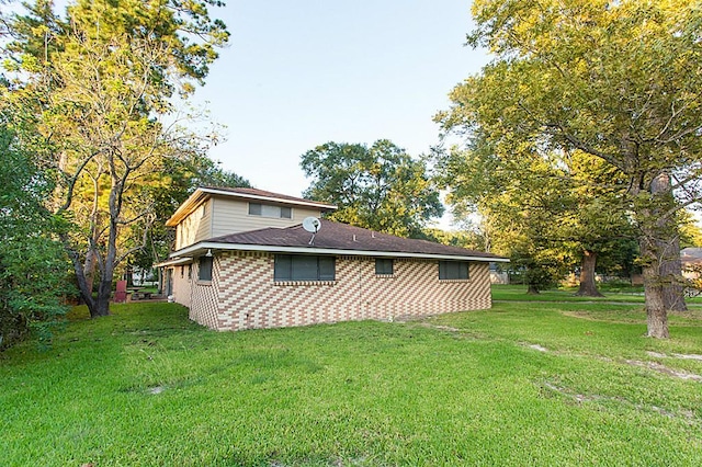 6407 Nuben St, Houston, TX 77091 - back of house featuring a lawn and brick siding