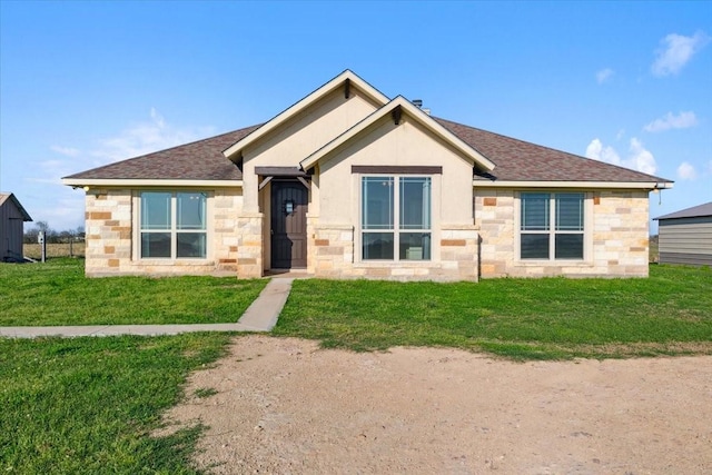 2407 Thuesen Rd, Beasley, TX 77417 - view of front of property with stone siding, roof with shingles, and a front yard