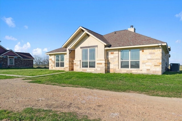 2407 Thuesen Rd, Beasley, TX 77417 - rear view of property featuring stone siding, a chimney, a shingled roof, and a yard