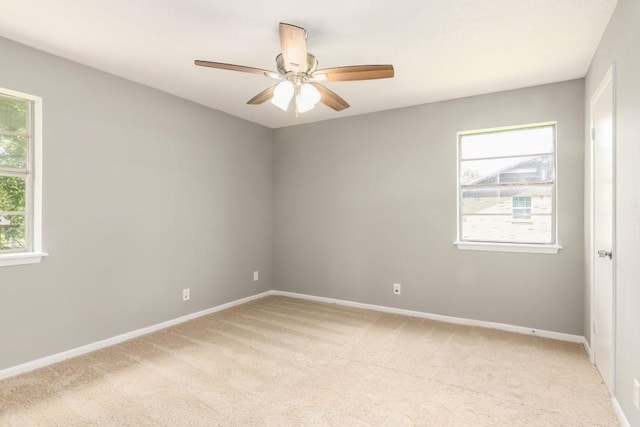 1314 Garrett St, Brenham, TX 77833 - empty room featuring light carpet and a ceiling fan