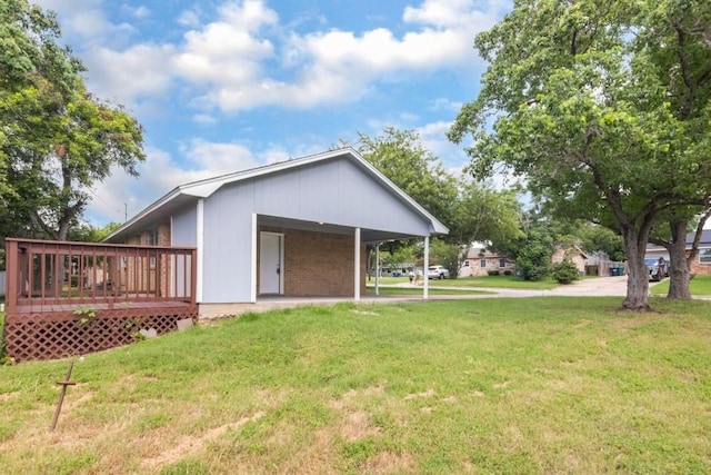 1314 Garrett St, Brenham, TX 77833 - back of property featuring a yard and a wooden deck