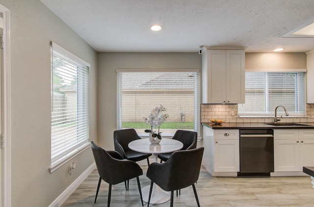 22523 Wildwood Grove Dr, Katy, TX 77450 - dining area with light wood-style floors, recessed lighting, and a textured ceiling