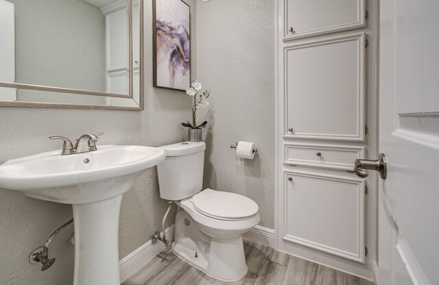 22523 Wildwood Grove Dr, Katy, TX 77450 - bathroom with wood finished floors and a textured wall