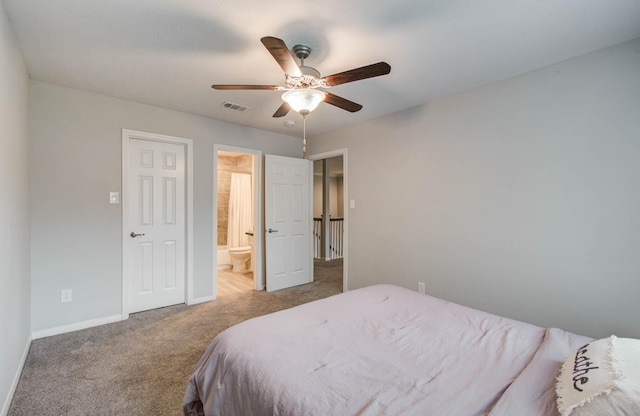 22523 Wildwood Grove Dr, Katy, TX 77450 - carpeted bedroom with ensuite bath and a ceiling fan