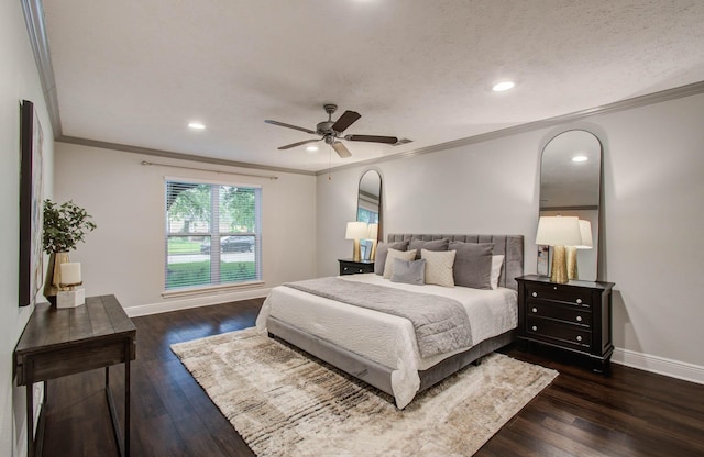 22523 Wildwood Grove Dr, Katy, TX 77450 - bedroom with ornamental molding, dark wood-style flooring, a ceiling fan, and recessed lighting