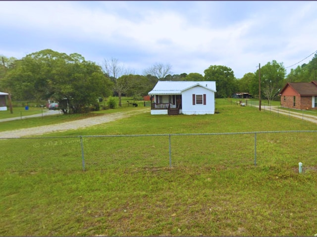 21384 Baptist Encampment Rd, New Caney, TX 77357 - view of front of property with a fenced backyard and dirt driveway