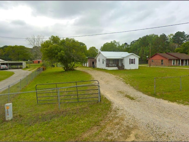 21384 Baptist Encampment Rd, New Caney, TX 77357 - view of front of house with dirt driveway