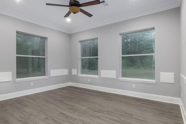 575 Hartman Rd, Silsbee, TX 77656 - empty room featuring dark wood finished floors, crown molding, ceiling fan, and recessed lighting