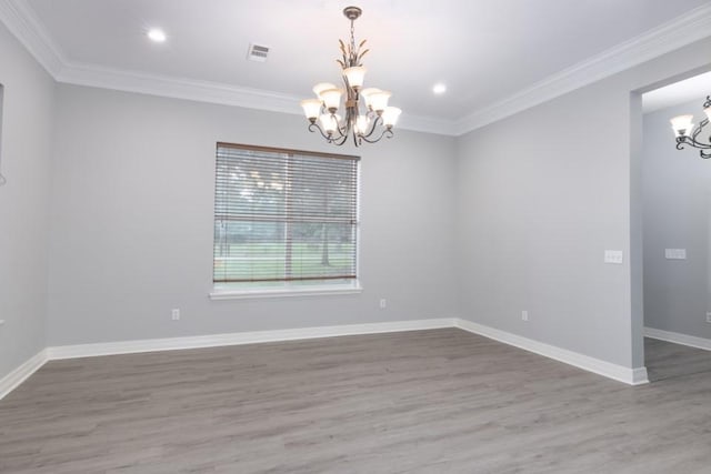 575 Hartman Rd, Silsbee, TX 77656 - empty room featuring a chandelier, wood finished floors, crown molding, and recessed lighting