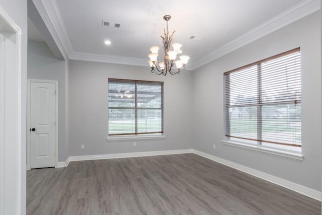 575 Hartman Rd, Silsbee, TX 77656 - unfurnished room with a chandelier, healthy amount of natural light, wood finished floors, and ornamental molding