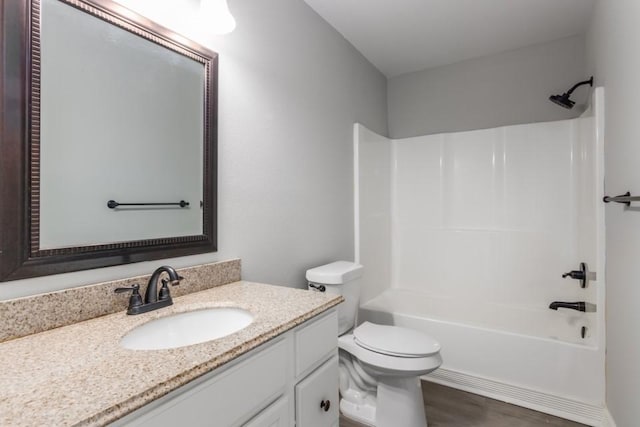 575 Hartman Rd, Silsbee, TX 77656 - bathroom featuring vanity,  shower combination, and wood finished floors