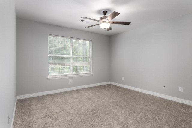 575 Hartman Rd, Silsbee, TX 77656 - carpeted spare room with a ceiling fan and baseboards