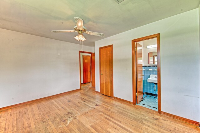 1726 Wilde Rock Way, Houston, TX 77018 - unfurnished bedroom with wood-type flooring, ensuite bathroom, and a ceiling fan
