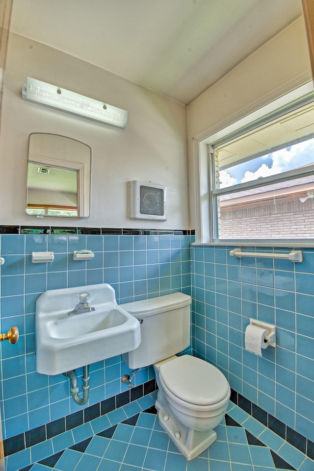 1726 Wilde Rock Way, Houston, TX 77018 - bathroom with tile patterned flooring, tile walls, and a wainscoted wall
