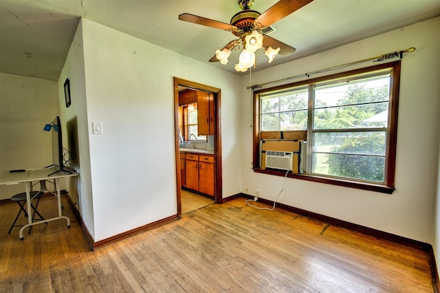 1726 Wilde Rock Way, Houston, TX 77018 - unfurnished room featuring light wood-style flooring, ceiling fan, cooling unit, and a desk