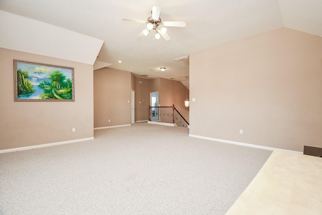 5823 Lundwood Ln, Houston, TX 77084 - unfurnished living room with attic access, light colored carpet, ceiling fan, and lofted ceiling