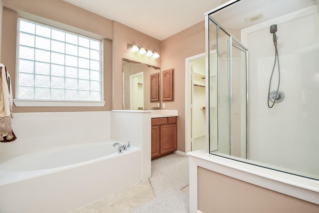 5823 Lundwood Ln, Houston, TX 77084 - full bathroom with vanity, a shower stall, and a garden tub