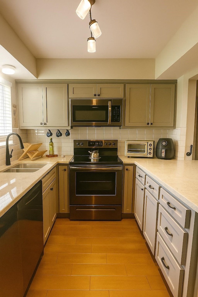 13022 Trail Hollow Dr Unit 3022, Houston, TX 77079 - kitchen with appliances with stainless steel finishes, tasteful backsplash, light wood-style flooring, and light stone countertops