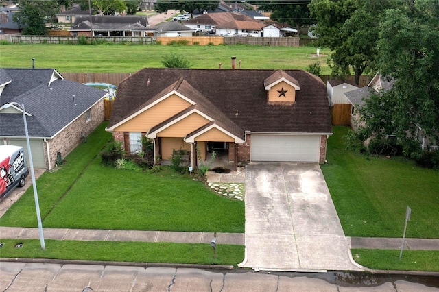 2010 Wildwood Dr, Deer Park, TX 77536 - view of front of home with brick siding, a garage, concrete driveway, a residential view, and roof with shingles