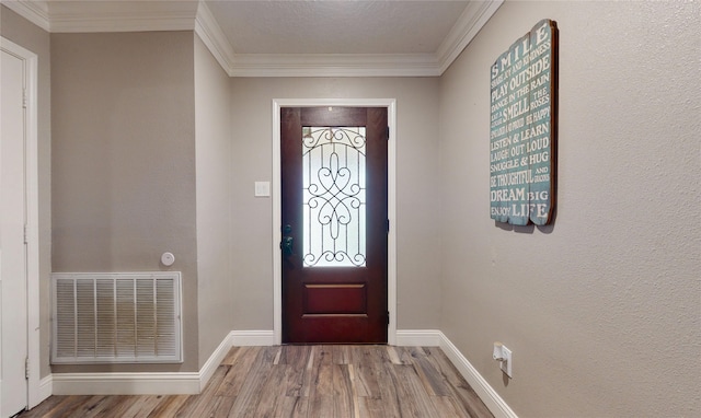 2010 Wildwood Dr, Deer Park, TX 77536 - foyer entrance featuring wood finished floors and crown molding