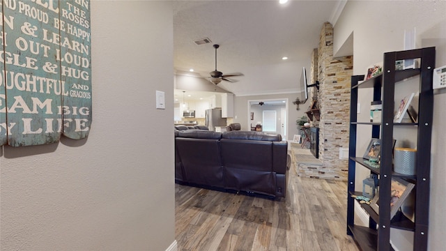 2010 Wildwood Dr, Deer Park, TX 77536 - living area featuring a ceiling fan, wood finished floors, ornamental molding, and recessed lighting