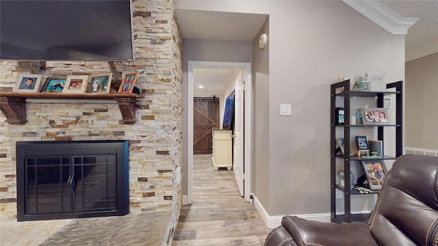 2010 Wildwood Dr, Deer Park, TX 77536 - living room with crown molding, wood finished floors, and a stone fireplace